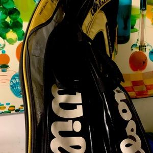 A nice slightly worn tennis bag. Holds 3-4 racquets plenty of space for shoes.